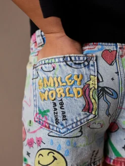 Next Mid Blue SmileyWorld® Graffiti Print Denim Shorts (3-16yrs)^ Shorts & Skirts