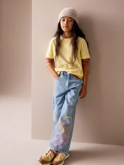 Next Mid Blue SmileyWorld® Print Wide Leg Jeans (3-16yrs)^ Jeans